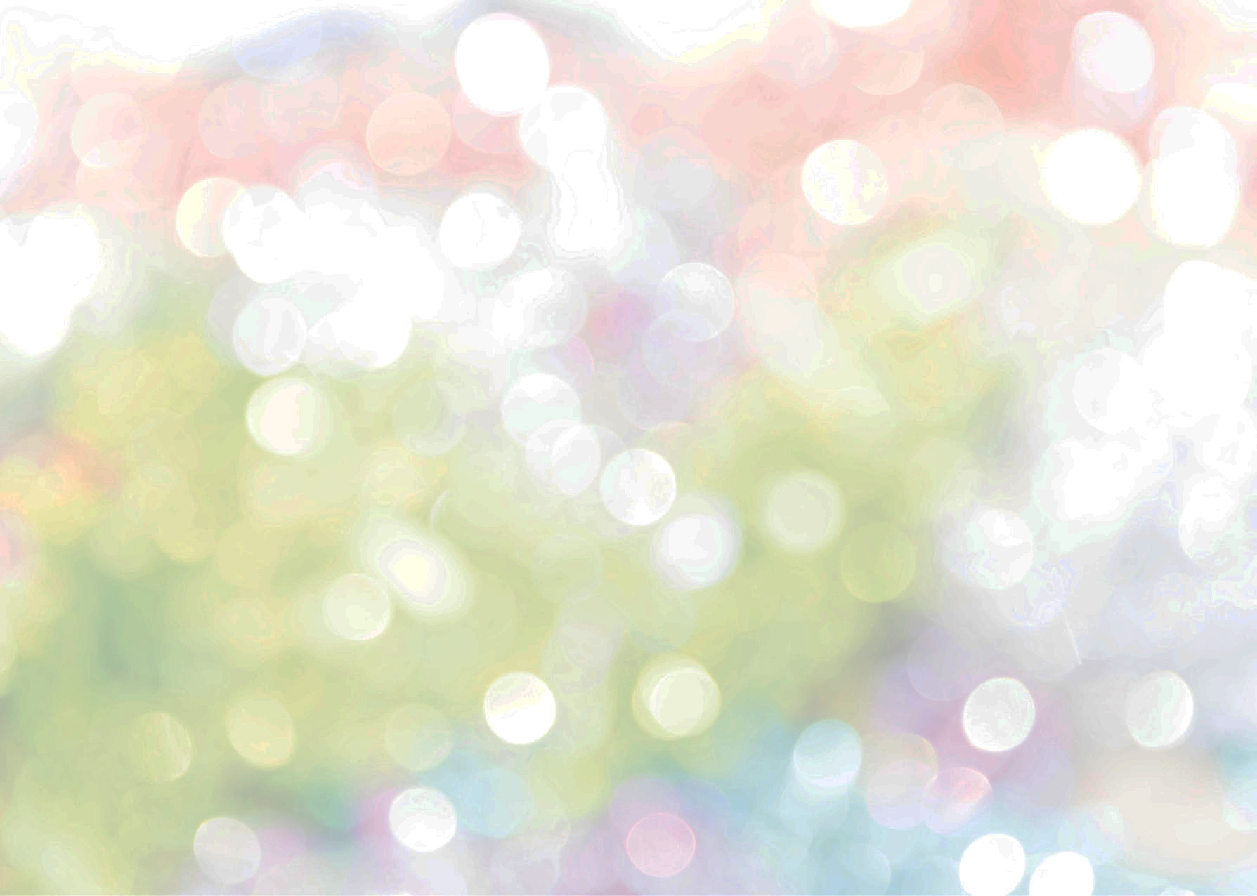 Close up of soft lights twinkling in green pink and grey